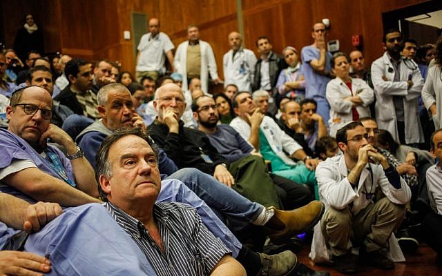 Israeli doctors seen during an emergency meeting at Jerusalem's Hadassah Ein-Kerem Hospital on February 4, 2014 (photo credit: Flash90) Israeli doctors seen during an emergency meeting at Jerusalem's Hadassah Ein-Kerem Hospital on February 4, 2014 (photo credit: Flash90)