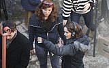 Natalie Portman (R) in Jerusalem's Nahlaot neighborhood directing a scene from 'A Tale of Love and Darkness,' February 11, 2014. (Yonatan Sindel/Flash 90)