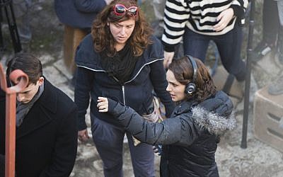 Natalie Portman (R) in Jerusalem's Nahlaot neighborhood directing a scene from 'A Tale of Love and Darkness,' February 11, 2014. (Yonatan Sindel/Flash 90)