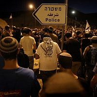 Israelis settlers and right wing activists hold evening prayers after attending a march in the rural area known as E1 near the Israeli settlement of Ma'ale Adumim on February 13, 2014. (photo credit: Yonatan Sindel/Flash90) Israelis settlers and right wing activists hold evening prayers after attending a march in the rural area known as E1 near the Israeli settlement of Ma'ale Adumim on February 13, 2014. (photo credit: Yonatan Sindel/Flash90)