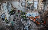 Rescue personnel at the scene of an explosion that killed five and injured 11 in the northern city of Acre, Monday, February 17, 2014 (photo credit: Avishag Shaar Yashuv/Flash90)