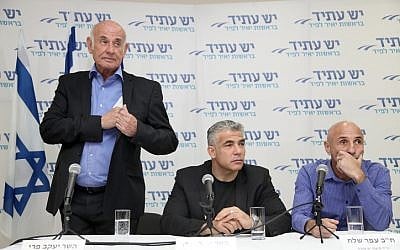 Leader of Yesh Atid political party Yair Lapid (center), MK Yaakov Perry and Ofer Shelah seen at a press conference in Tel Aviv on February 20, 2014. (photo credit: Gideon Markowicz/Flash90)