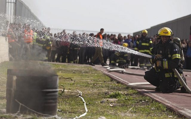 Firefighters participating in an IDF Home Front Command drill on February 24 (photo credit: Flash 90) Firefighters participating in an IDF Home Front Command drill on February 24 (photo credit: Flash 90)