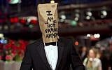 Actor Shia LaBeouf poses for photographers, with a paper bag over his head that says 'I am not famous anymore,' on the red carpet for the film 'Nymphomaniac' at the International Film Festival Berlinale in Berlin, on February 9, 2014. (photo credit: AP/Axel Schmidt)