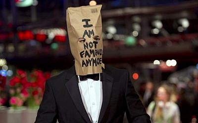 Actor Shia LaBeouf poses for photographers, with a paper bag over his head that says 'I am not famous anymore,' on the red carpet for the film 'Nymphomaniac' at the International Film Festival Berlinale in Berlin, on February 9, 2014. (photo credit: AP/Axel Schmidt)