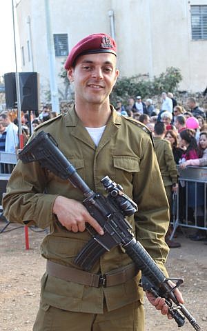 Having just received the red beret that signifies the completion of his training, Private Isaac Moyal, 29, who was born in France and grew up in England, is the oldest person to ever join the IDF's Paratroopers Brigade. (The Times of Israel/Rebecca McKinsey) Having just received the red beret that signifies the completion of his training, Private Isaac Moyal, 29, who was born in France and grew up in England, is the oldest person to ever join the IDF's Paratroopers Brigade. (The Times of Israel/Rebecca McKinsey)