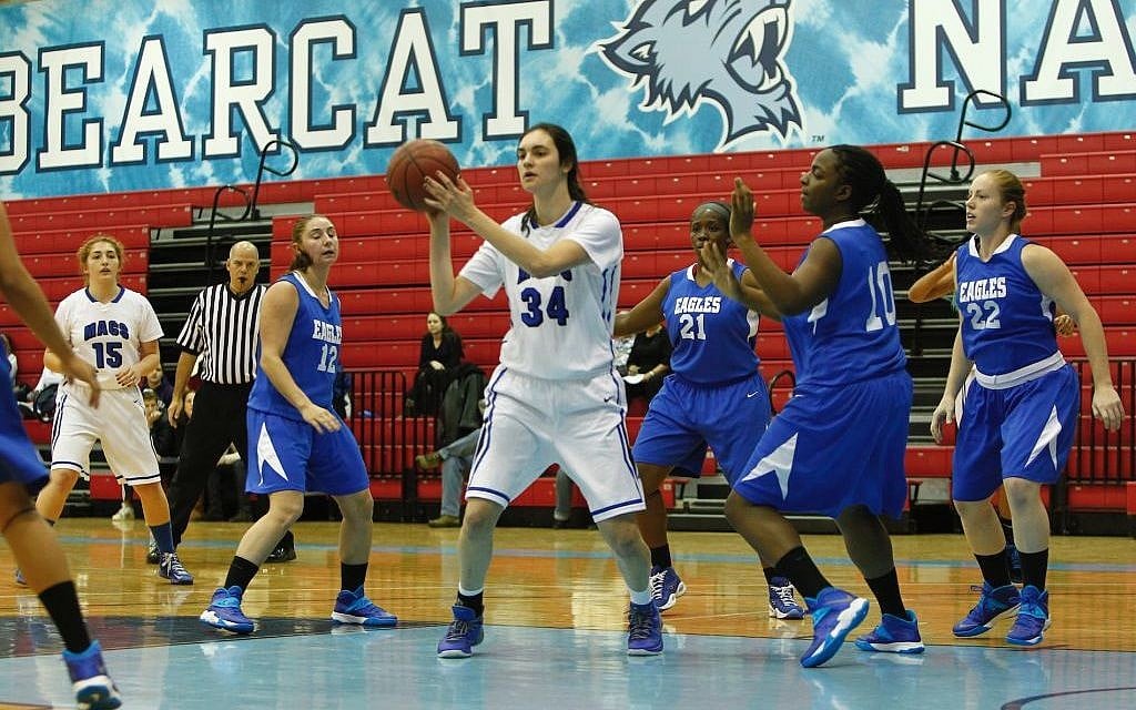 In this Nov. 24, 2013 loss to the College of Elizabeth, Yeshiva University Maccabees forward Rebecca Yoshor, No. 34, grabbed 22 rebounds, a category in which she leads the nation. (Courtesy of Yeshiva University Sports Information Office/JTA) In this Nov. 24, 2013 loss to the College of Elizabeth, Yeshiva University Maccabees forward Rebecca Yoshor, No. 34, grabbed 22 rebounds, a category in which she leads the nation. (Courtesy of Yeshiva University Sports Information Office/JTA)