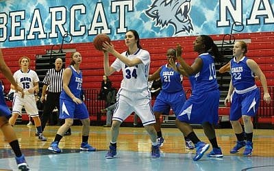 In this Nov. 24, 2013 loss to the College of Elizabeth, Yeshiva University Maccabees forward Rebecca Yoshor, No. 34, grabbed 22 rebounds, a category in which she leads the nation. (Courtesy of Yeshiva University Sports Information Office/JTA)