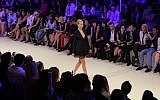 A model presents a designer dress during the Fashion Forward show in Dubai, United Arab Emirates, Thursday, October 17, 2013 (photo credit: AP/Kamran Jebreili)