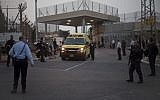 Illustrative: An ambulance leaves Rimonim Prison while Israeli police SWAT teams enter the prison, on Sunday, February 23, 2014. (AP/Ariel Schalit)
