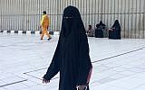 A veiled woman walks in Mecca, Saudi Arabia.(photo credit: AP Photo/Aya Batrawy, File)