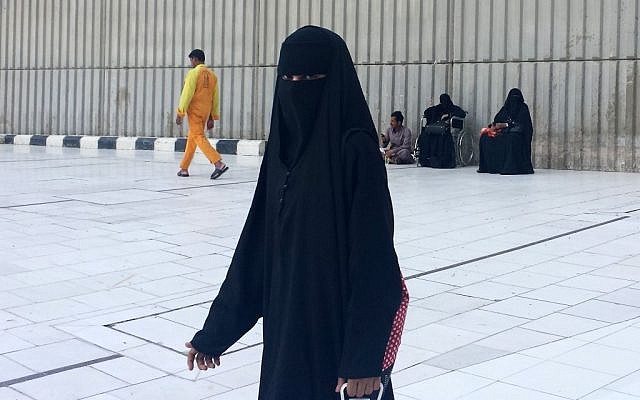 A veiled woman walks in Mecca, Saudi Arabia.(photo credit: AP Photo/Aya Batrawy, File)