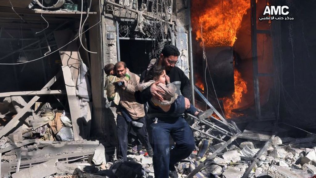 Syrian men help survivors out of a destroyed building after government warplanes attack Aleppo, Syria, on Feb. 8, 2014. (photo credit: AP/Aleppo Media Center AMC) Syrian men help survivors out of a destroyed building after government warplanes attack Aleppo, Syria, on Feb. 8, 2014. (photo credit: AP/Aleppo Media Center AMC)