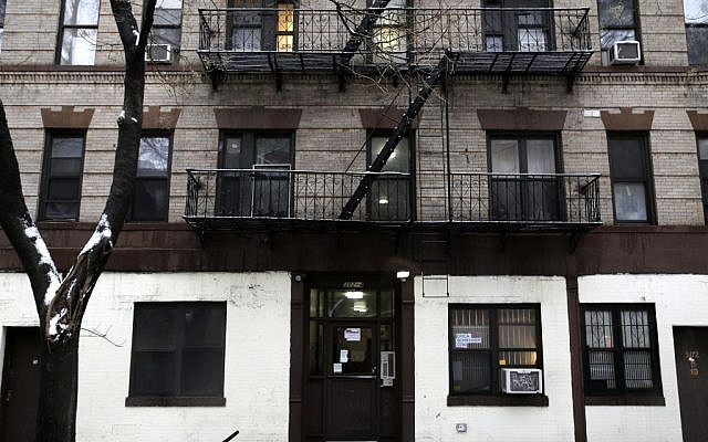 The building at 320 Mott St. is seen in New York, Wednesday, Feb. 5, 2014. Four people are in custody on drug charges after police executed search warrants at three apartments in the building. (AP Photo/Seth Wenig) The building at 320 Mott St. is seen in New York, Wednesday, Feb. 5, 2014. Four people are in custody on drug charges after police executed search warrants at three apartments in the building. (AP Photo/Seth Wenig)