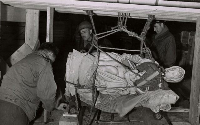 This 1945 handout photo provided by the Smithsonian Institution shows the rescuing of Michelangelo’s Madonna and Child in Altaussee, Austria. (photo credit: AP/Smithsonian Institution) This 1945 handout photo provided by the Smithsonian Institution shows the rescuing of Michelangelo’s Madonna and Child in Altaussee, Austria. (photo credit: AP/Smithsonian Institution)
