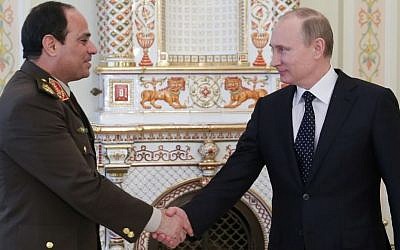Russian President Vladimir Putin, right, shakes hands with Egypt's Military chief Field Marshal Abdel-Fattah el-Sissi in the Novo-Ogaryovo residence outside Moscow on Thursday, Feb. 13, 2014. (Photo credit: AP Photo/RIA Novosti, Mikhail Metzel, Presidential Press Service)