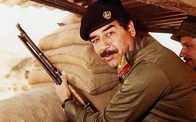 Saddam Hussein during Iran-Iraqi war in the 1980s. (photo credit: Wikimedia Commons/AFP/Getty Images public domain) 