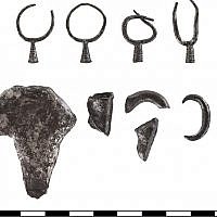 The dissected earrings and other contents of a silver hoard found at Abel Beth Maacah. (photo credit: Gabi Laron)