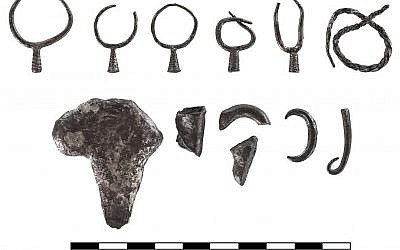 The dissected earrings and other contents of a silver hoard found at Abel Beth Maacah. (photo credit: Gabi Laron)