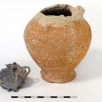 A Bronze Age juglet and the silver hoard, before it was dissected, found at Abel Beth Maacah. (photo credit: Gabi Laron)