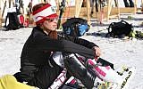 Lebanon's Jacky Chamoun sits near the alpine ski course finish area at the Sochi 2014 Winter Olympics, Thursday, Feb. 13, 2014, in Krasnaya Polyana, Russia. (AP Photo/Luca Bruno)