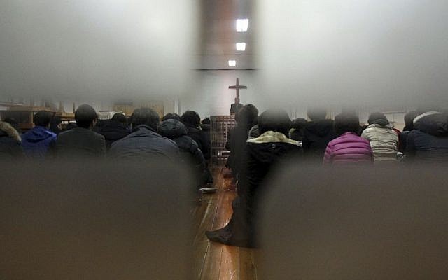 Members from Jincheon Jungang Presbyterian Church attend a service at their church in Jincheon, South Korea, Monday, February 17, 2014, the day after a Sinai terror group targeted a bus filled with Korean members of the church at Taba, Egypt. (photo credit: AP/Yonhap, Kim Hyung-woo) Members from Jincheon Jungang Presbyterian Church attend a service at their church in Jincheon, South Korea, Monday, February 17, 2014, the day after a Sinai terror group targeted a bus filled with Korean members of the church at Taba, Egypt. (photo credit: AP/Yonhap, Kim Hyung-woo)