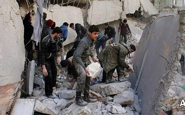 Syrians inspect the rubble of destroyed buildings following a government airstrike in Aleppo, Syria, Jan. 31, 2014 (photo credit: AP /Aleppo Media Center, AMC) Syrians inspect the rubble of destroyed buildings following a government airstrike in Aleppo, Syria, Jan. 31, 2014 (photo credit: AP /Aleppo Media Center, AMC)