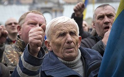 Men shout slogans during mourning for protesters killed in recent clashes, in central Kiev, Ukraine on Saturday. (photo credit: AP/Darko Bandic)