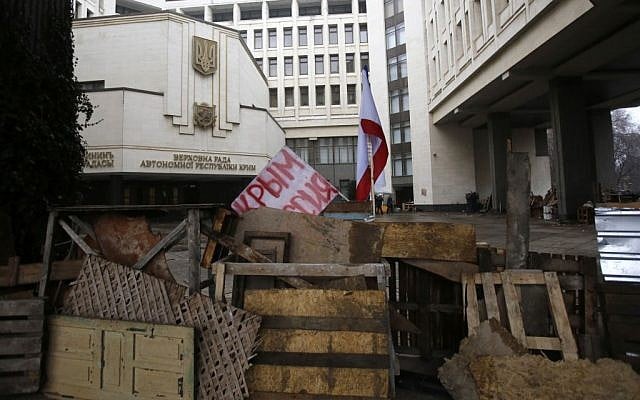 Barricades in front of a local government building with a banner which reads: 'Crimea Russia' in Simferopol, Crimea, Ukraine, Thursday, Feb. 27, 2014. (photo credit: AP/Darko Vojinovic) Barricades in front of a local government building with a banner which reads: 'Crimea Russia' in Simferopol, Crimea, Ukraine, Thursday, Feb. 27, 2014. (photo credit: AP/Darko Vojinovic)