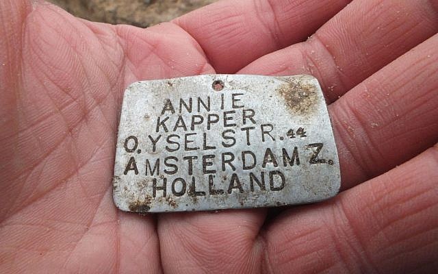 Metal nameplate of murdered Jewish Dutch girl, unearthed at the end of 2013 (photo courtesy: Wojtek Mazurek) Metal nameplate of murdered Jewish Dutch girl, unearthed at the end of 2013 (photo courtesy: Wojtek Mazurek)