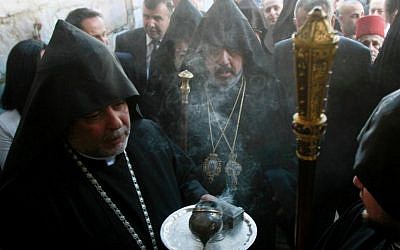 Armenian patriarch of Jerusalem, Archbishop Nurhan Manougian (C), arrives at the Church of the Nativity in the biblical West Bank town of Bethlehem, on January 18, 2014 during the Armenian Christmas celebrations (photo credit: AFP/File Musa al-Shaer)
