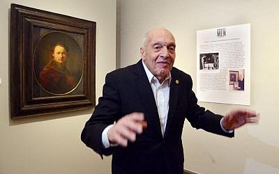 German-born Harry Ettlinger, a Jewish member of the 'Monuments Men,' stands in front of a Rembrandt painting at the art museum Kunsthalle in Karlsruhe, southern Germany on Saturday, February 15, 2014 (photo credit: DPA/AFP Uli Deck)