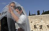 Illustrative photo of a couple having a wedding picture taken at the Western Wall, in the Old City of Jerusalem, April 2011. (Nati Shohat/Flash90)
