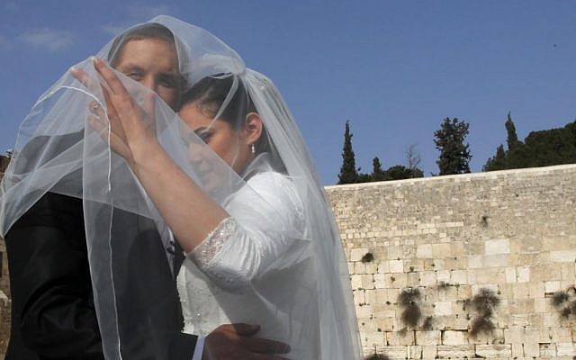Illustrative photo of a couple having a wedding picture taken at the Western Wall, in the Old City of Jerusalem, April 2011. (Nati Shohat/Flash90) Illustrative photo of a couple having a wedding picture taken at the Western Wall, in the Old City of Jerusalem, April 2011. (Nati Shohat/Flash90)