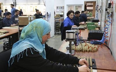 A Palestinian woman works at SodaStream's plant in Mishor Adumim, February 2, 2014 (photo credit: Nati Shohat/Flash90)