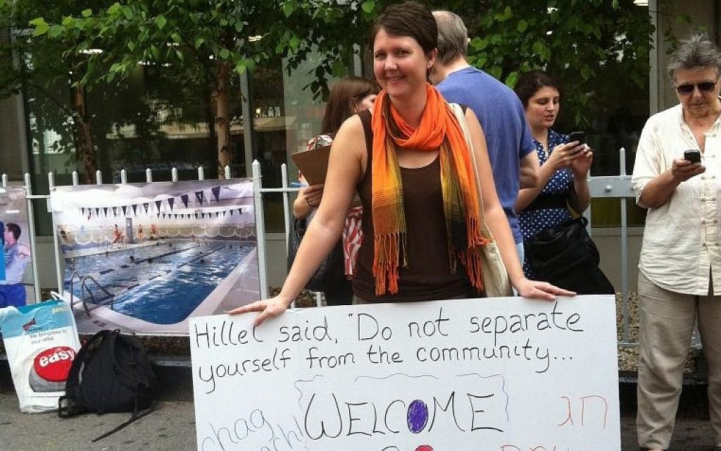 A Jewish Voice for Peace activist protests outside New York City's 14th Street Y in May 2012 after the Jewish institution canceled a 'Go and Learn' event organized by the group's youth arm that was scheduled for a rented room in the Y's building. (Courtesy of Jewish Voice for Peace/JTA) A Jewish Voice for Peace activist protests outside New York City's 14th Street Y in May 2012 after the Jewish institution canceled a 'Go and Learn' event organized by the group's youth arm that was scheduled for a rented room in the Y's building. (Courtesy of Jewish Voice for Peace/JTA)