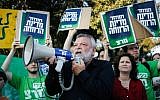 Knesset Members from Meretz and party activists gather outside the Knesset in Jerusalem before the voting on the state budget, June 17, 2013 (photo credit: Flash90)