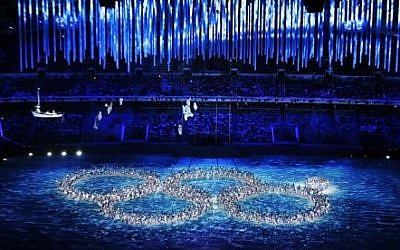 Performers recreate the ring that did not open during the opening ceremony during the closing ceremony of the 2014 Winter Olympics, Sunday, Feb. 23, 2014, in Sochi, Russia (photo credit: AP Photo/Ivan Sekretarev)