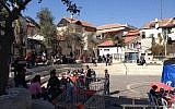 The cast and crew of 'A Tale of Love and Darkness' tucking into schnitzel and salad in a courtyard off Agrippas Street in Jerusalem (photo credit: Jessica Steinberg/Times of Israel)