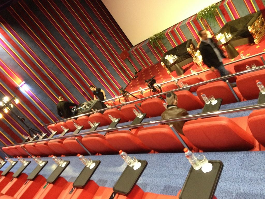 Red leather stadium seats, carpeted walls and personal snack trays in one of the VIP screening rooms (photo credit: Jessica Steinberg/Times of Israel) Red leather stadium seats, carpeted walls and personal snack trays in one of the VIP screening rooms (photo credit: Jessica Steinberg/Times of Israel)