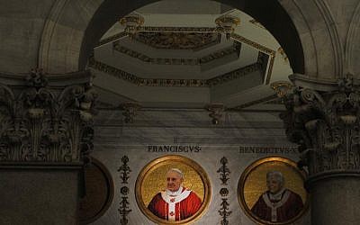 Mosaics representing Pope Francis (L) and Pope Benedict XVI are pictured at the Basilica of Saint Paul (photo credit: AFP/File Tiziana Fabi)