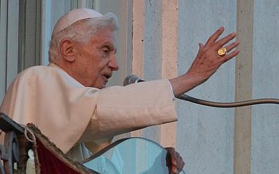 Pope Benedict XVI blesses faithful from a balcony upon arrival in Castel Gandolfo, on February 28, 2013, before stepping down later in the day (photo credit: AFP/File Vincenzo Pinto)