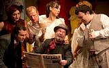 Nicolae Botezatu, seated, and cast of Bucharest's Jewish State Theater performing last year. (The Jewish State Theater of Bucharest/JTA)