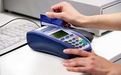 Illustration: Credit card in use.  via Shutterstock