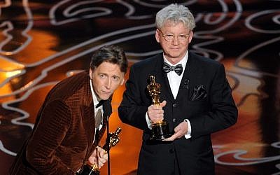 Filmmakers Nick Reed (L) and Malcolm Clarke accept the Best Documentary, Short Subject award for 'The Lady In Number 6' onstage during the Oscars at the Dolby Theatre on March 2, 2014 in Hollywood, California. (photo  credit: AFP/Kevin Winter/Getty Images)