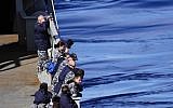 Crew members on the HMAS SUCCESS look for debris in the southern Indian Ocean during the search for missing Malaysia Airlines Flight MH370 on Wednesday March 26, 2014. (photo credit: Julianne Cropley/AFP)