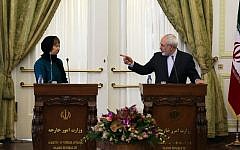EU foreign affairs chief Catherine Ashton, left, and Iranian Foreign Minister Mohammad Javad Zarif give a joint press conference following a meeting on March 9, 2014 in Tehran.  (photo credit: AFP/ATTA KENARE)