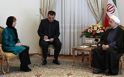 A handout picture released by the official website of the Iranian president shows the Islamic Republic's President Hassan Rouhani (R) meeting with EU foreign policy chief Catherine Ashton (L) on March 9, 2014 in Tehran. (photo credit: AFP PHOTO / HO / PRESIDENT.IR)