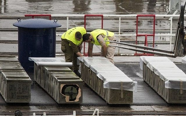 Israeli security forces inspect boxes of M-302 rockets that were unloaded from the Panamanian-flagged Klos-C vessel on March 9, 2014 at the southern Israeli port of Eilat. The vessel, which was allegedly transporting arms from Iran to Gaza, was escorted into the port of Eilat after Israeli naval commandos seized it on March 5, 2014. (photo credit: Jack Guez/AFP) Israeli security forces inspect boxes of M-302 rockets that were unloaded from the Panamanian-flagged Klos-C vessel on March 9, 2014 at the southern Israeli port of Eilat. The vessel, which was allegedly transporting arms from Iran to Gaza, was escorted into the port of Eilat after Israeli naval commandos seized it on March 5, 2014. (photo credit: Jack Guez/AFP)
