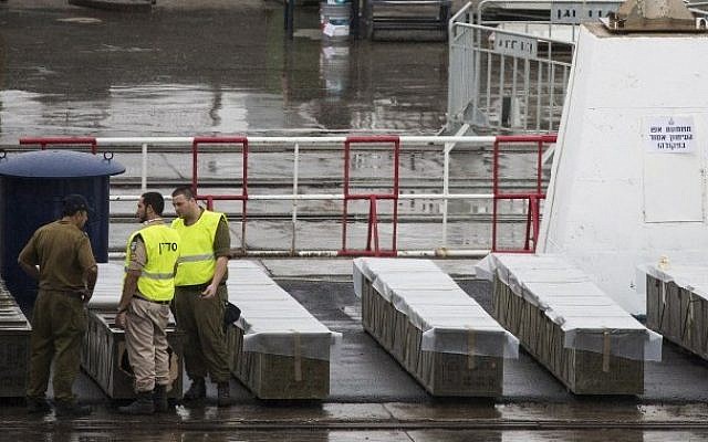 IDF troops inspect boxes of M-302 rockets that were unloaded from the Panamanian-flagged Klos-C vessel on March 9, 2014 at the southern Israeli port of Eilat. (photo credit: Jack Guez/AFP) IDF troops inspect boxes of M-302 rockets that were unloaded from the Panamanian-flagged Klos-C vessel on March 9, 2014 at the southern Israeli port of Eilat. (photo credit: Jack Guez/AFP)